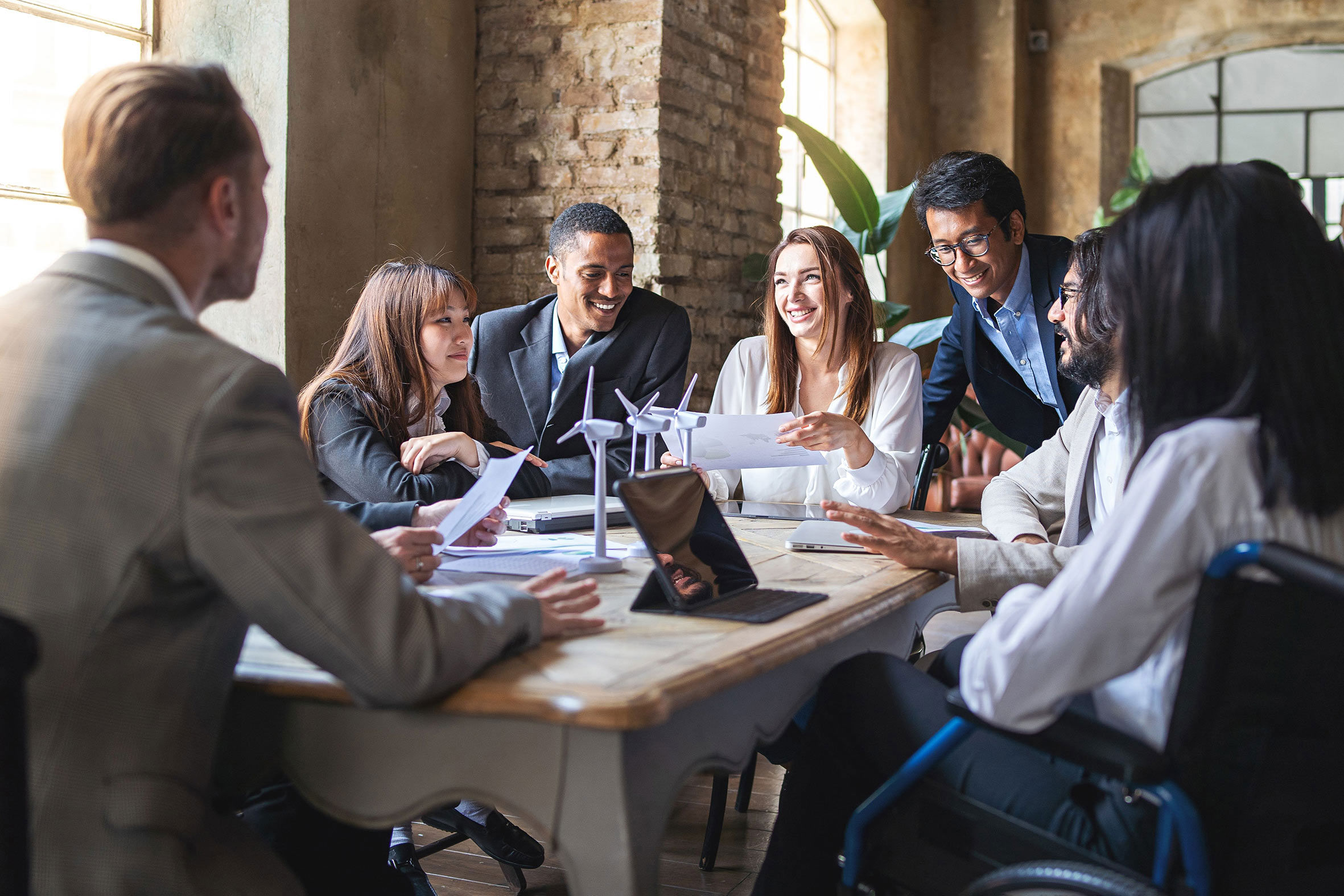 Diverse group of professionals having a meeting at a desk